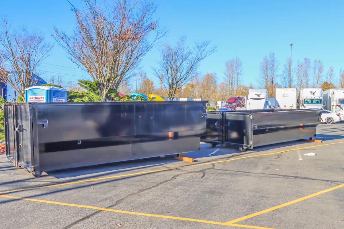 Professional dumpster rental service with roll-off container on residential driveway in Batesburg-Leesville